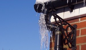 icicles forming on the gutters of a home